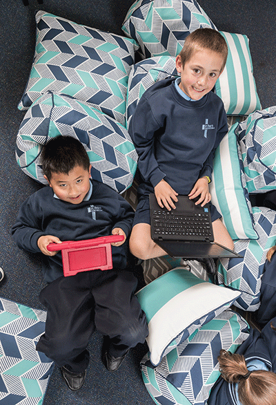 Image of two primary school students using computers